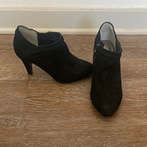 2” heeled black suede boots. Zipper on inside and decorative button outside.